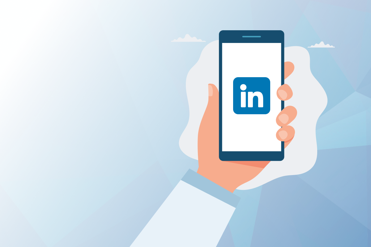 Graphic of a hand holding an iPhone with the LinkedIn logo on the screen.
