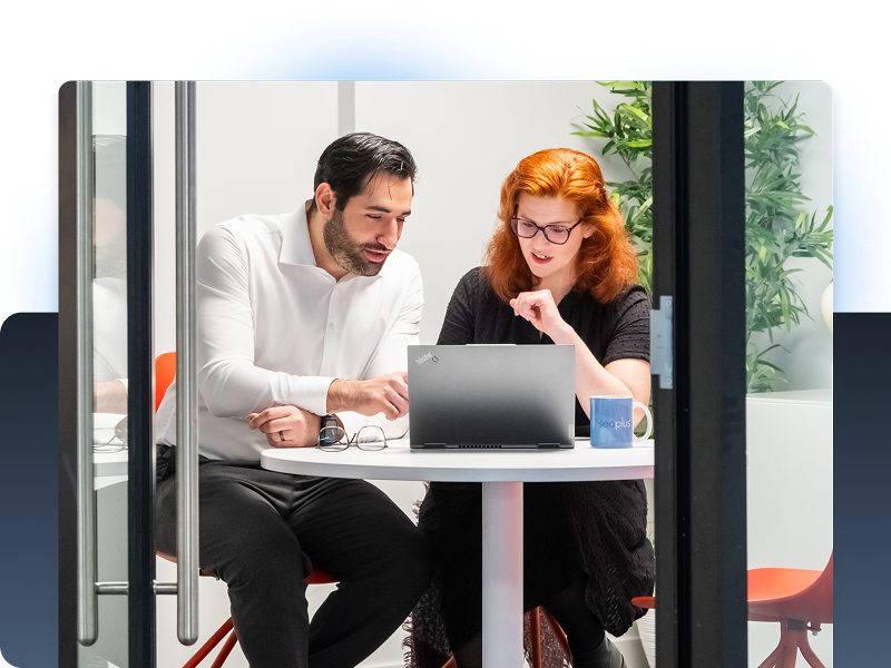 Two team members working together